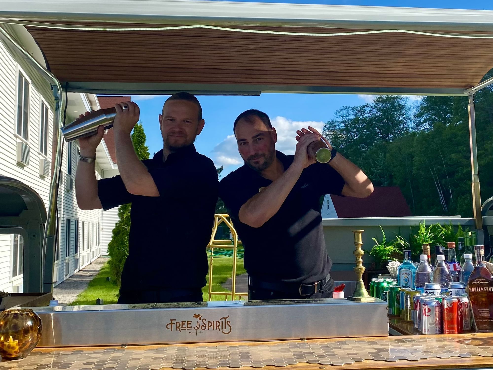 bartenders mixing up signature cocktails 