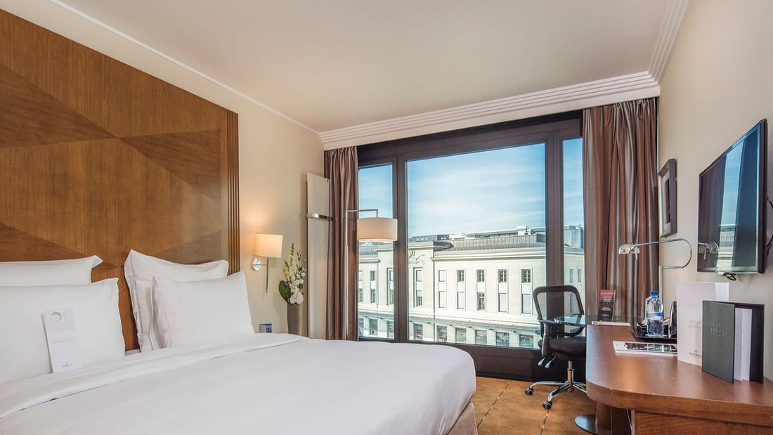 King bed in Superior Room with city view at Warwick Geneva