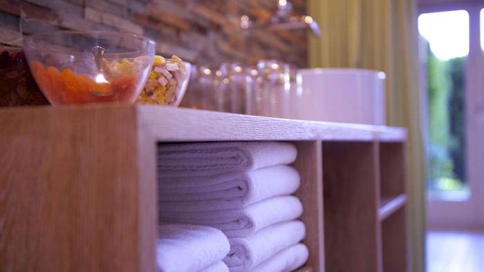 Closeup on towels in a cupboard at the spa at Originals Hotels