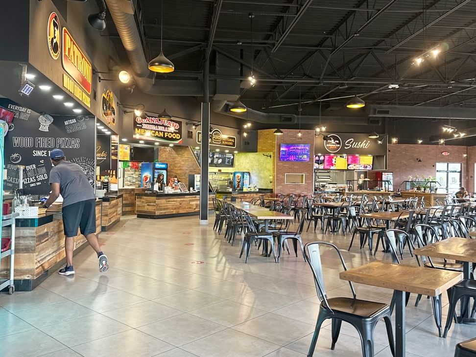 a large food court with tables and chairs