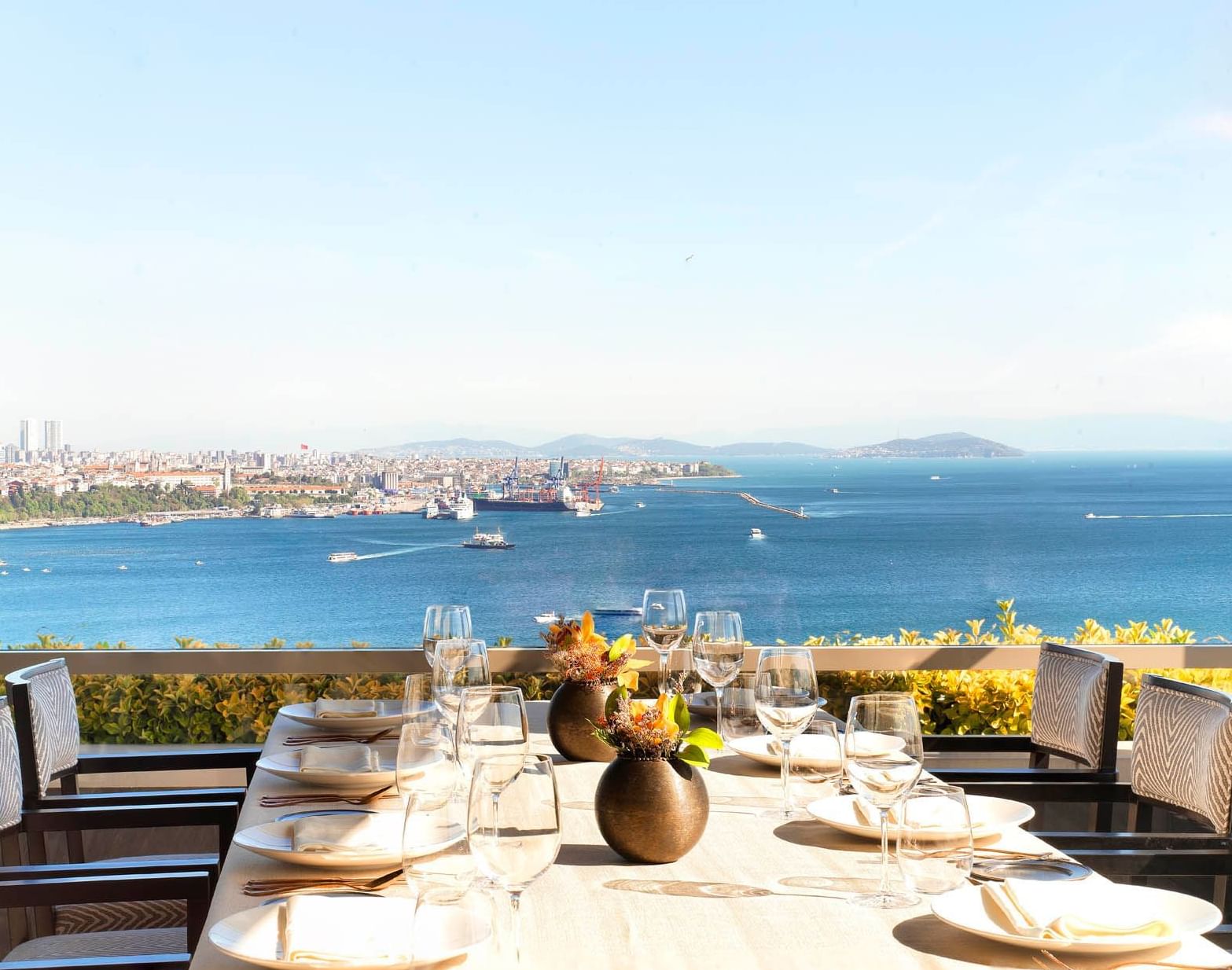 Rooftop dining arrangement with an ocean view in Izaka Terrace at CVK Park Bosphorus Hotel Istanbul