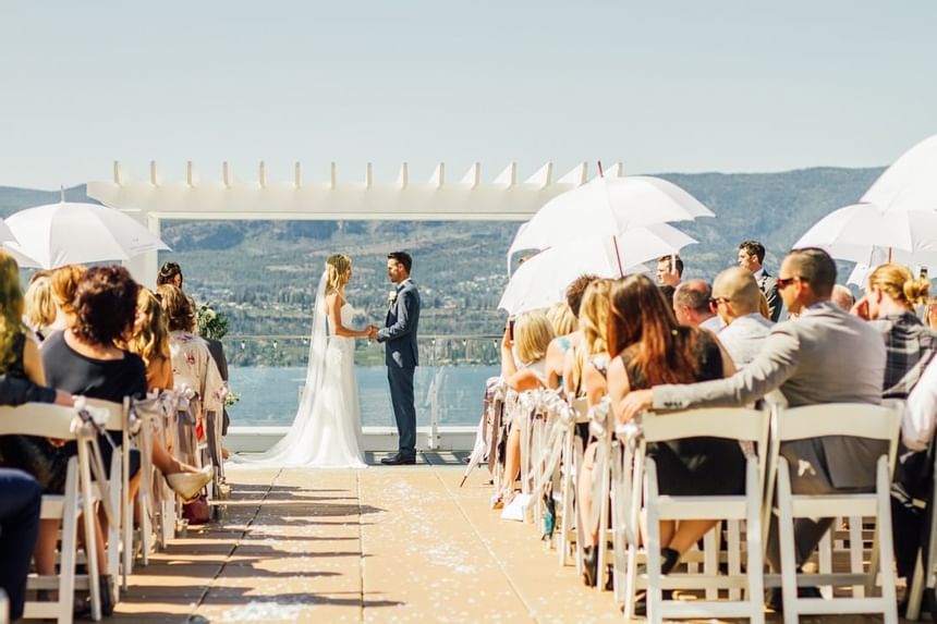 A wedding ceremony at the Patio in Manteo Resort Waterfront