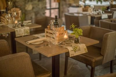 Close-up of a 2-top table in Grotto Valle at Liebes Rot Flueh