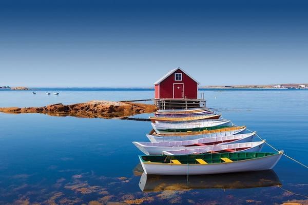 Multi-coloured boats on water on Fogo Island