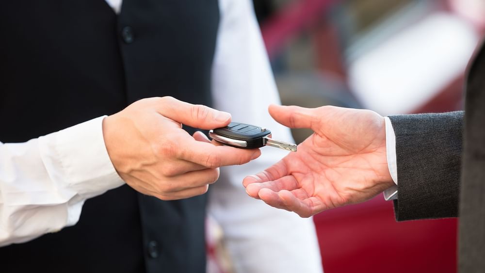 Car key being handed to Valet