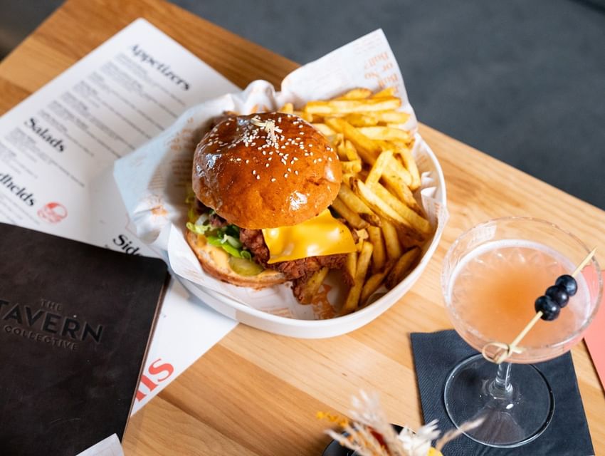 Cheeseburger with French fries and a cocktail served at The Tavern Restaurant at Sandman Sheffield Quays