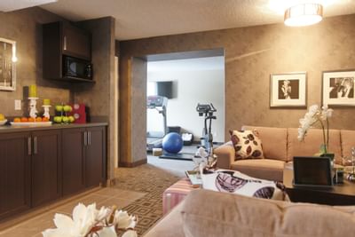 a hotel room with a kitchen and exercise area