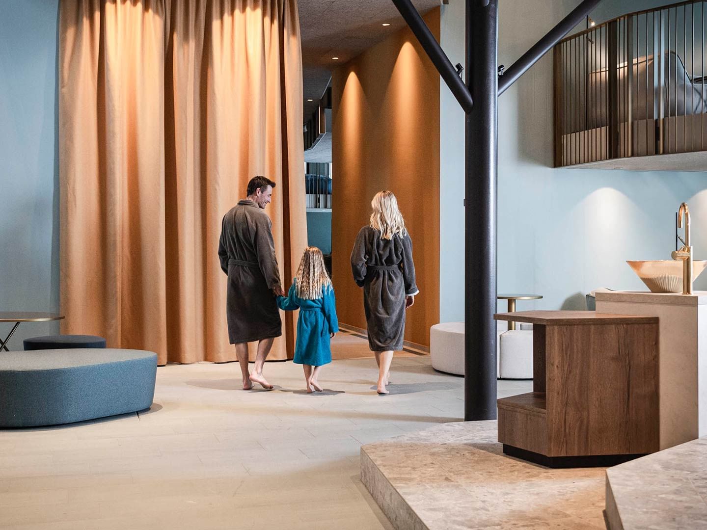 A family in bathrobes at Acquapura Spa in Falkensteiner Hotels