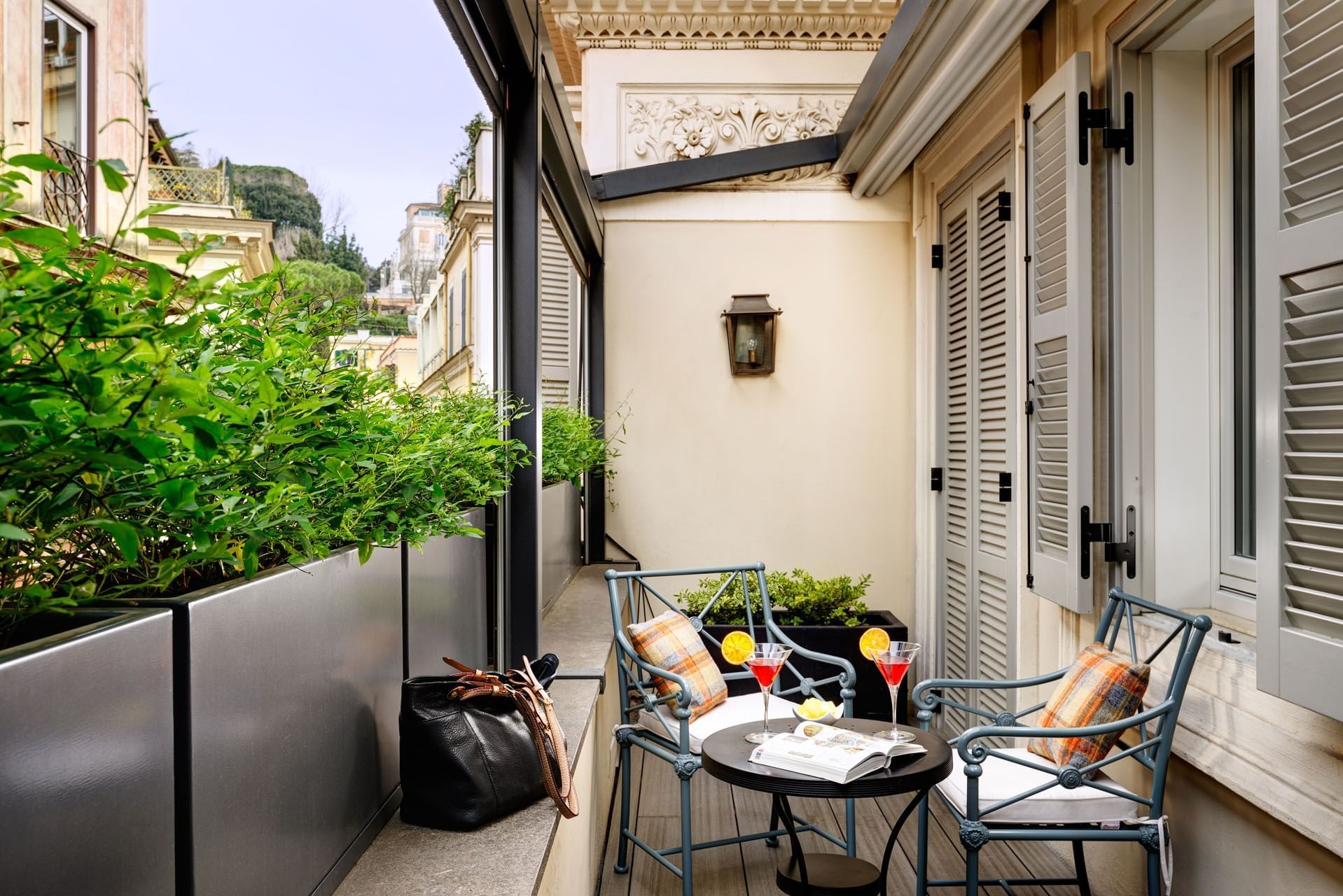 Dining table arranged on the terrace of Babuino Suite at Babuino 181