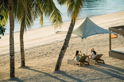 Ladies lounging by the beach in Sand Box at Discovery Samal