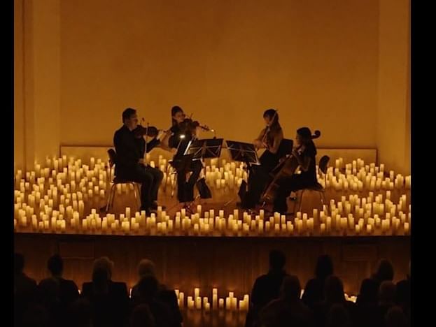 Four musicians perform in candlelight concerts at Live Aqua Resorts and Residence Club