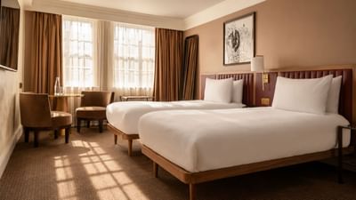 Two beds in an accessible room at The May Fair Hotel, London.