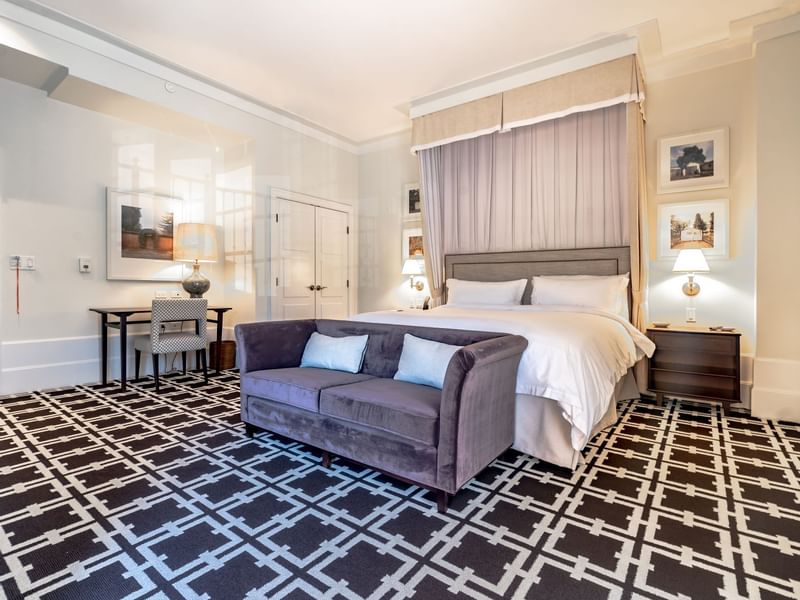a bed and couch in a hotel room