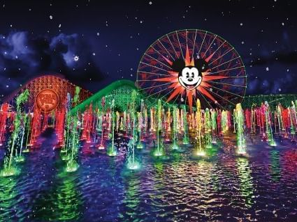 Colorful fountains and Mickey Mouse Ferris wheel at Disney California Adventure® Park.