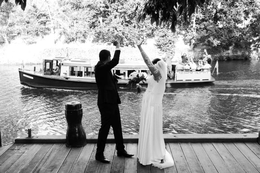 B&W image of Wedded couple on a dock at Amora Hotel Melbourne