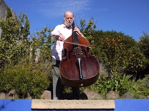 Man playing a double bass violin at Freycinet Lodge