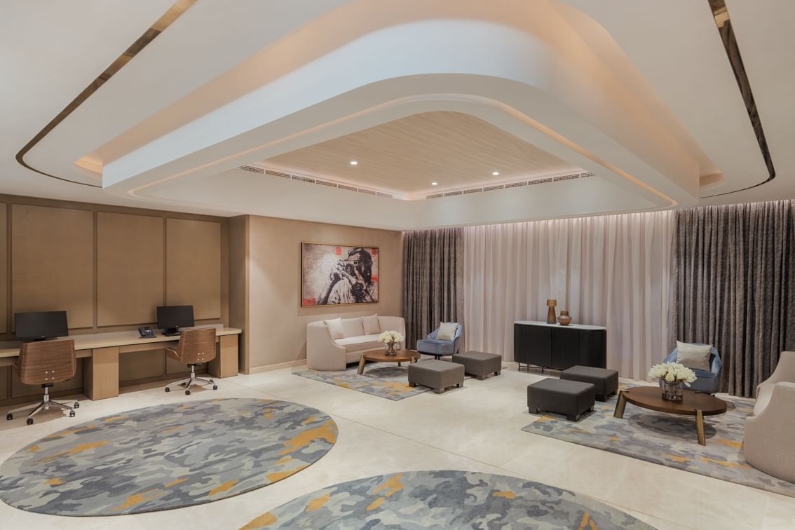 Business Studio 2 at Paramount Hotel Midtown with a modern lounge, cosy seating, workspace, artistic decor, and soft lighting
