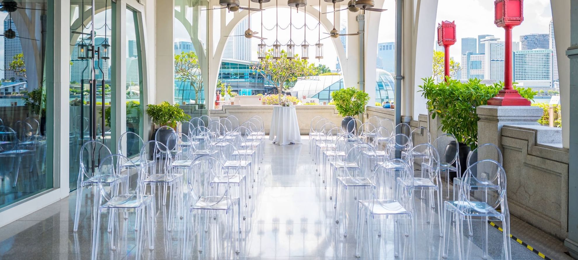 Outdoor event space with rows of transparent chairs in The Clifford Pier at The Fullerton Bay Singapore