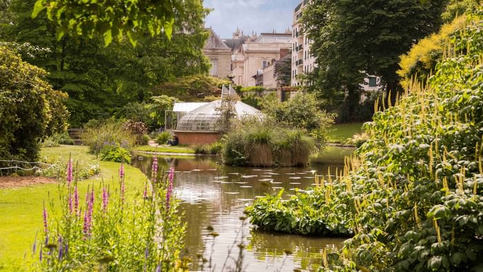 View of the pond in the garden at Hotel du Grand Monarque