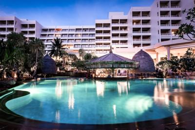 View of outdoor pool area of Paradox Hotels during night