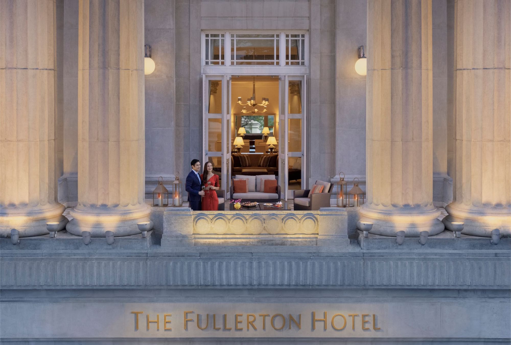 Couple posing by Governor Suite Balcony at The Fullerton Hotel Singapore