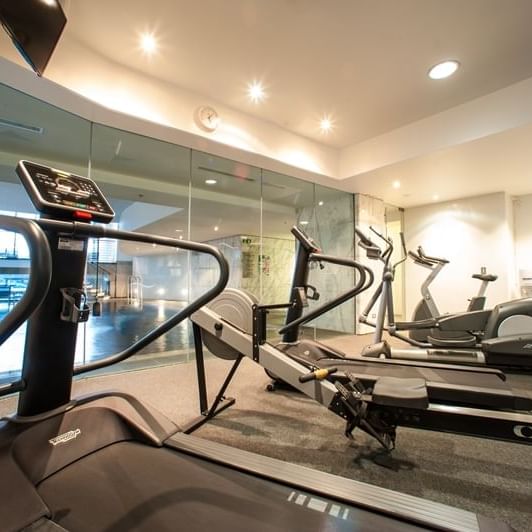 Exercise machines in the gym at Pullman Quay Grand Sydney