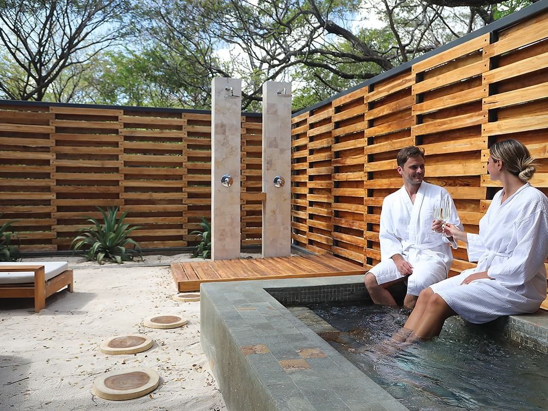 a couple in a spa pool area
