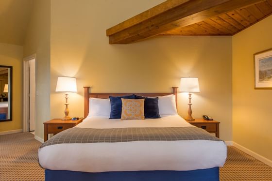 Close up on the king bed in the Historic Queen at Wolfeboro Inn