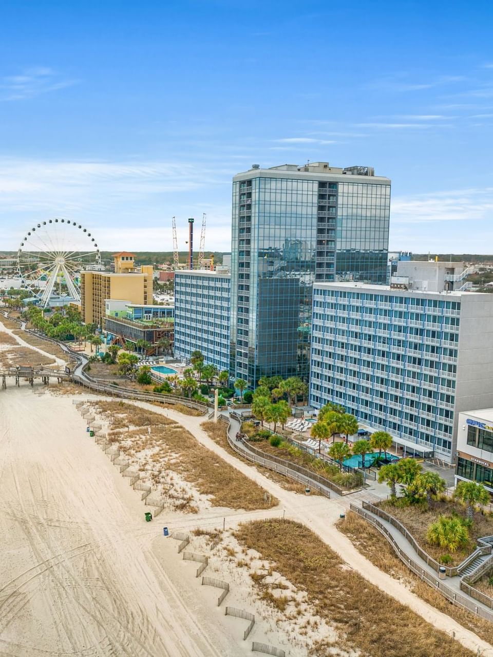 The exterior of The Yachtsman Resort with sandy beach