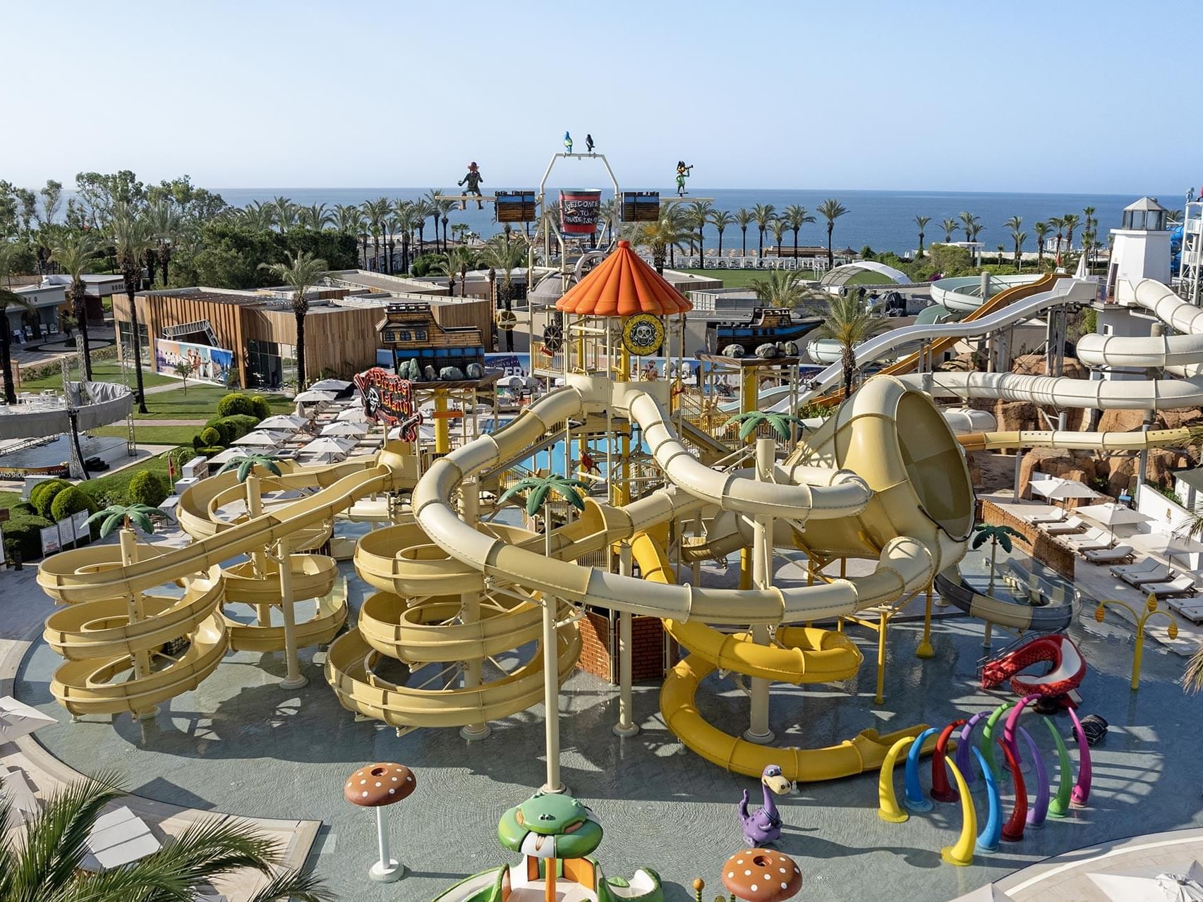 Aerial view of water slides in Aquapark on a sunny day at Titanic Deluxe Lara