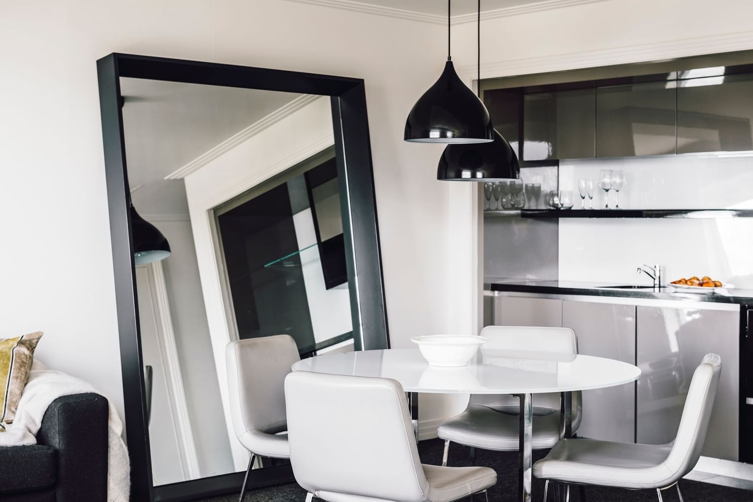 Dining table & large mirror in Junior Suite at Como Melbourne