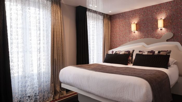 Bed in Hotel du Vieux Saule bedroom at The Original Hotels