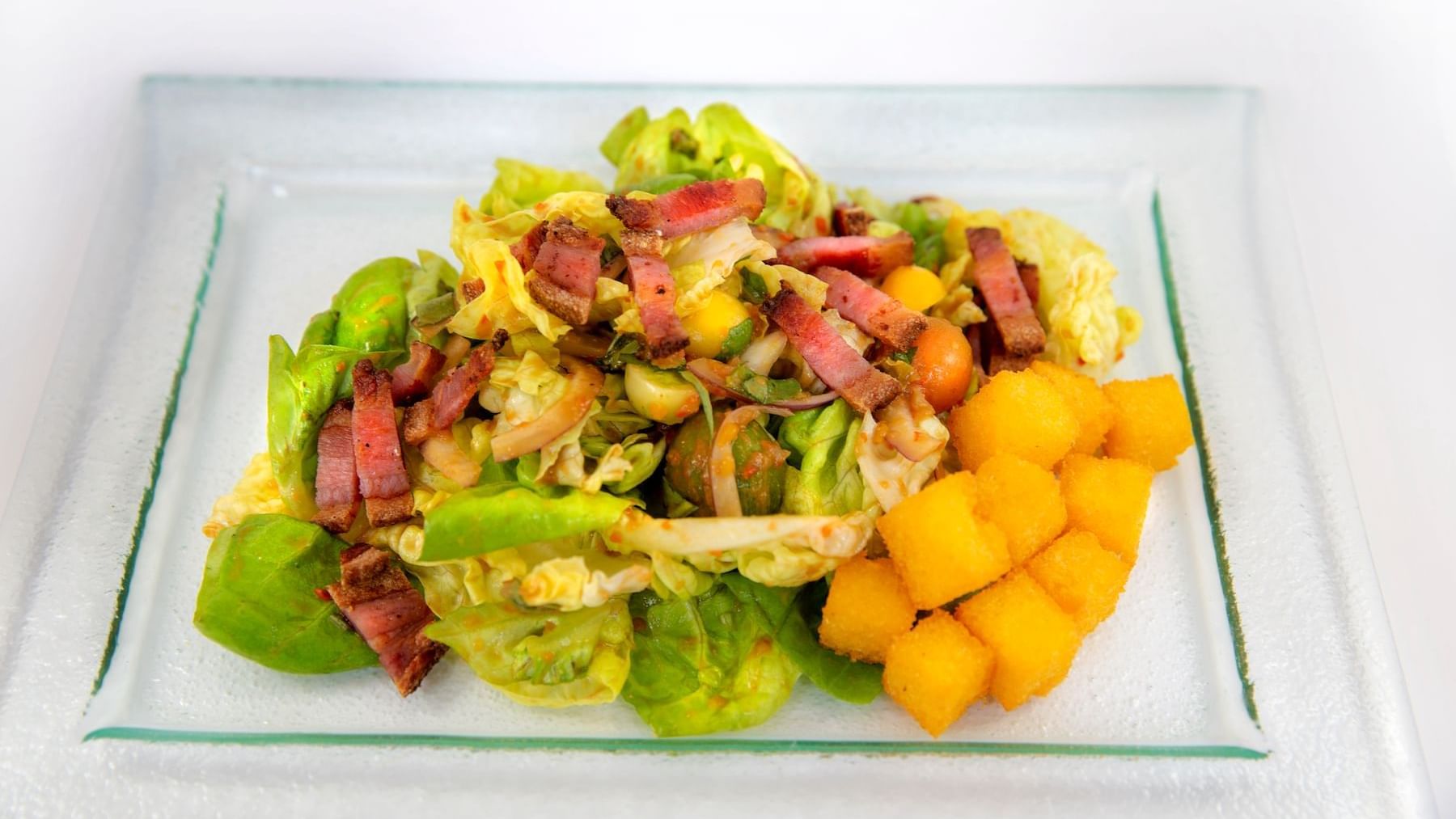 Close-up of a salad served in Cena Ristorante at Chateaux Deer Valley