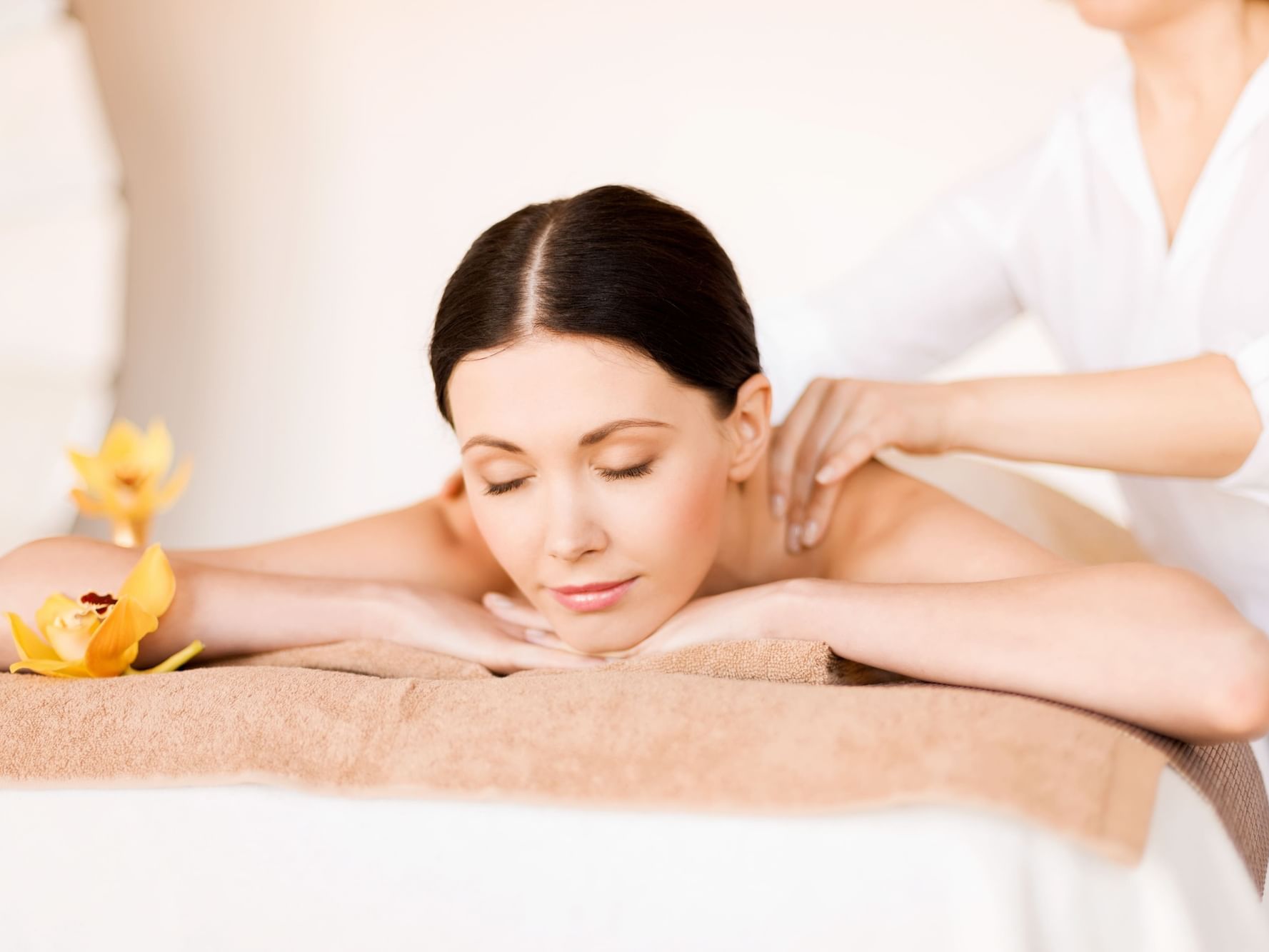 Lady having a massage in Aramsa Spa at Paradox Singapore