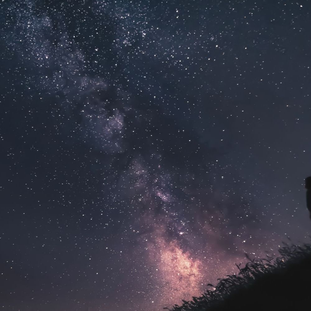 Silhouette of a man stargazing at night near Waikiki Resort Hotel by Sono