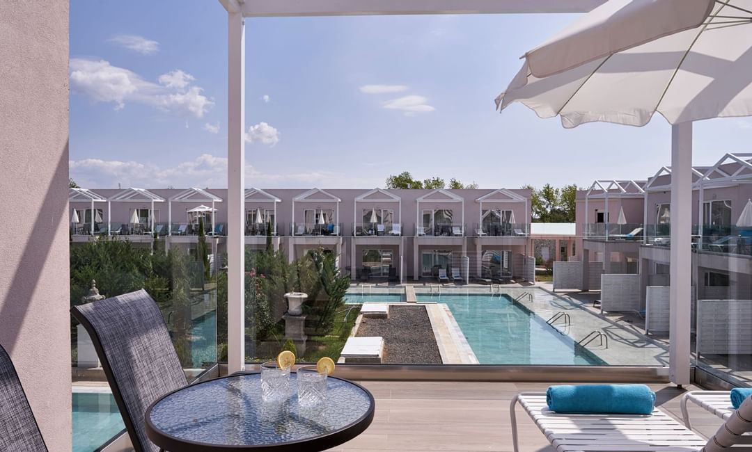 Balcony in One-Bedroom Suite with a pool view at Kairaba Hotels