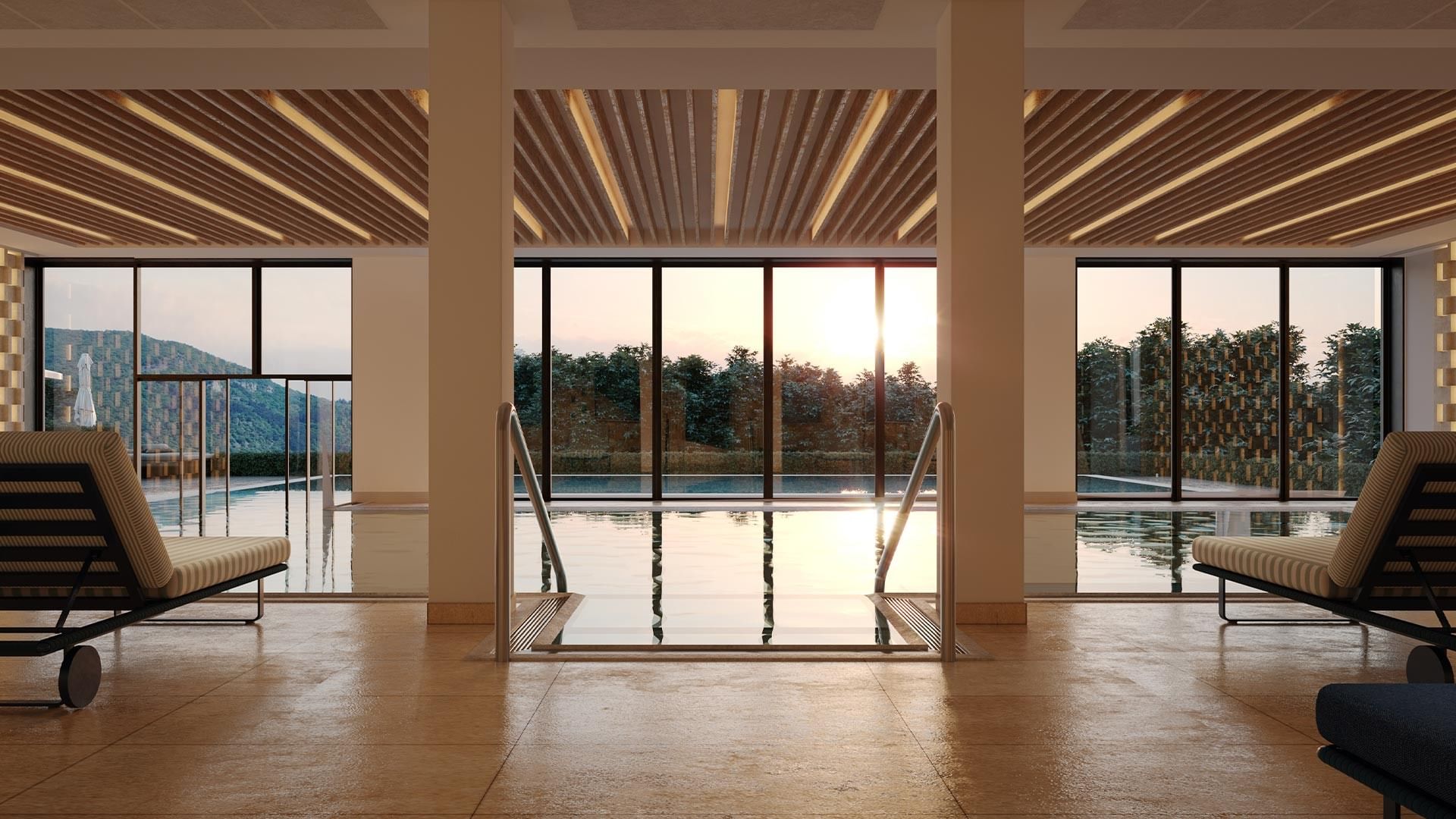 Modern spa with large pool, lounge chairs, and glass walls showcasing an outdoor view of trees and mountains.