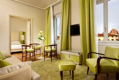 Light green chairs in the bedroom at Grand Hotel Minerva