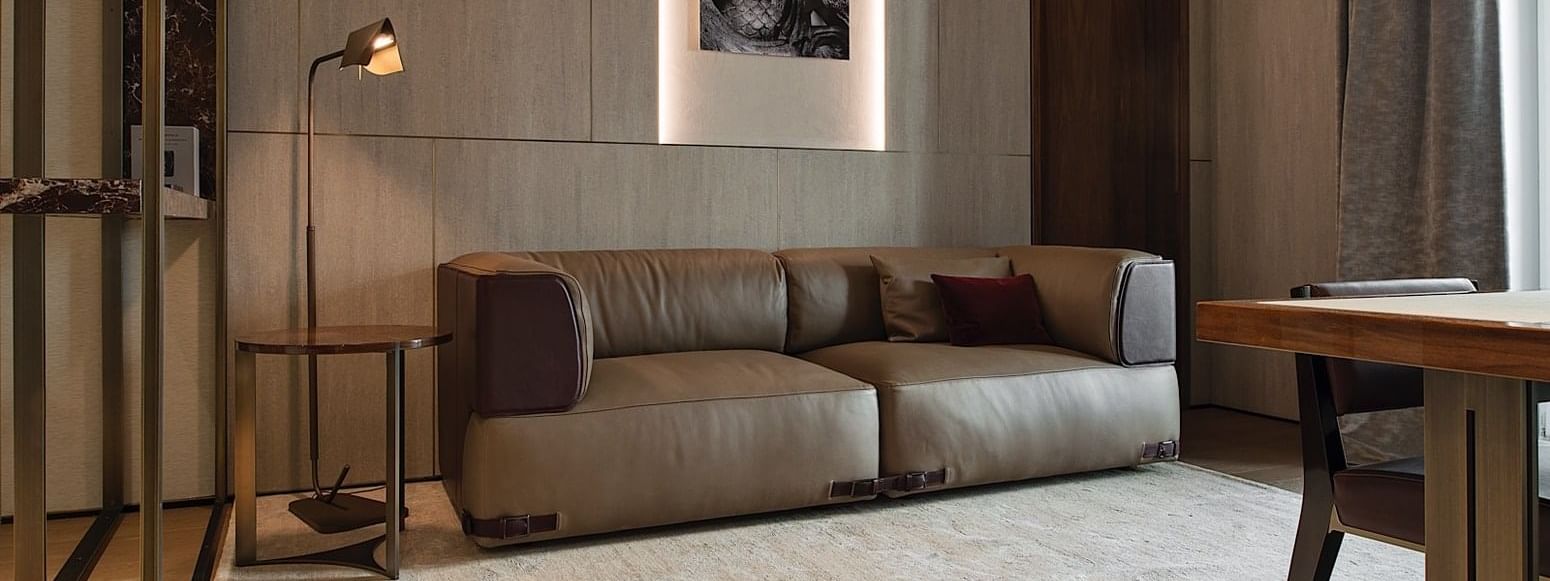 Sofa in living room in Deluxe Suite 4 at Fendi Private Suites