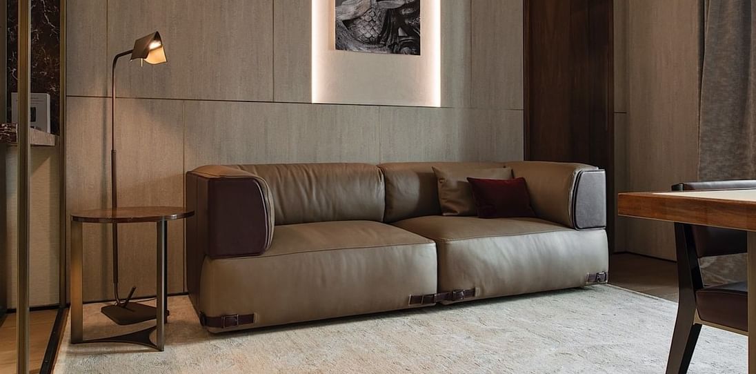 Sofa in living room in Deluxe Suite 4 at Fendi Private Suites