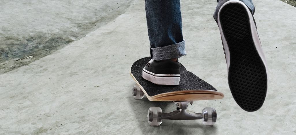 Skateboarder riding at skate park