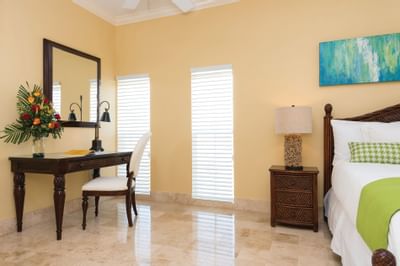 Interior view of bedroom in Island Suite at Windsong Resort On The Reef