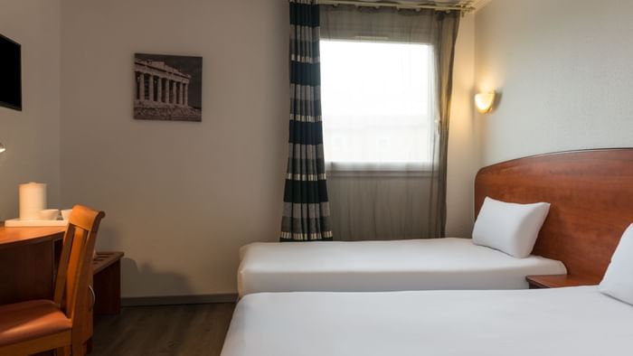 Twin Beds in a room at Hotel La Belle Etape
