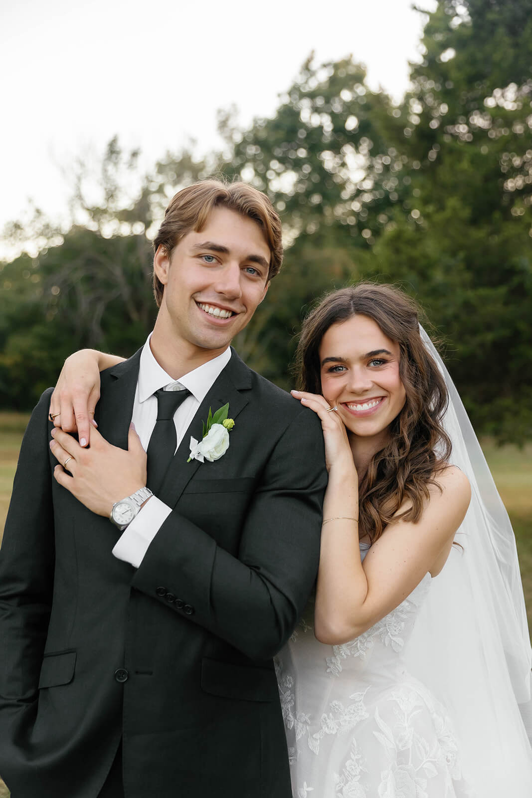 A newly wed couple posing with a loving gaze at each other