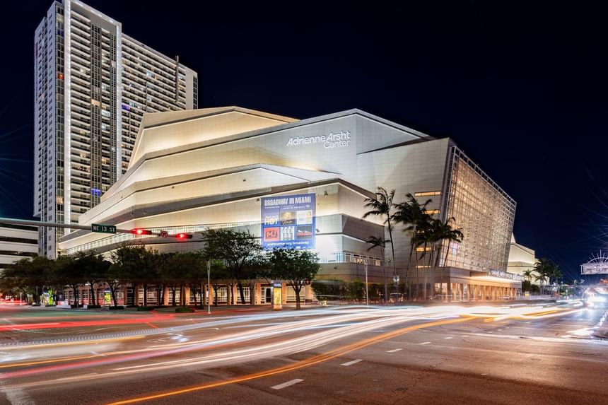 Nighttime view of Adrienne Arsht Center with traffic on road at The 27 Wynwood