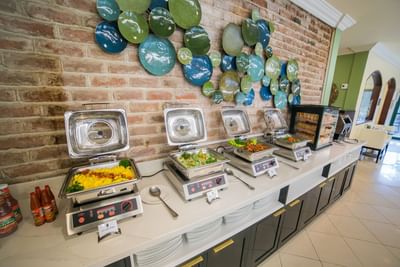 Opened breakfast buffet served for people in Mingles Bar & Lounge at Courtleigh Hotel & Suites