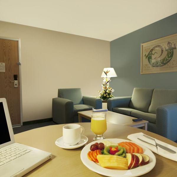 Interior of a room with a living and dining area at Fiesta Inn