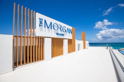 Hotel exterior with sign at The Morgan Resort Spa Village