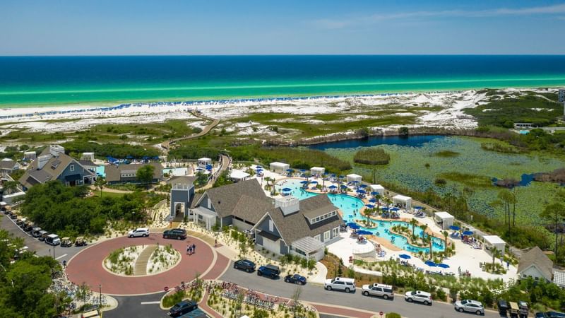 Aerial view of the hotel complex, car park & sea at Watersound Inn