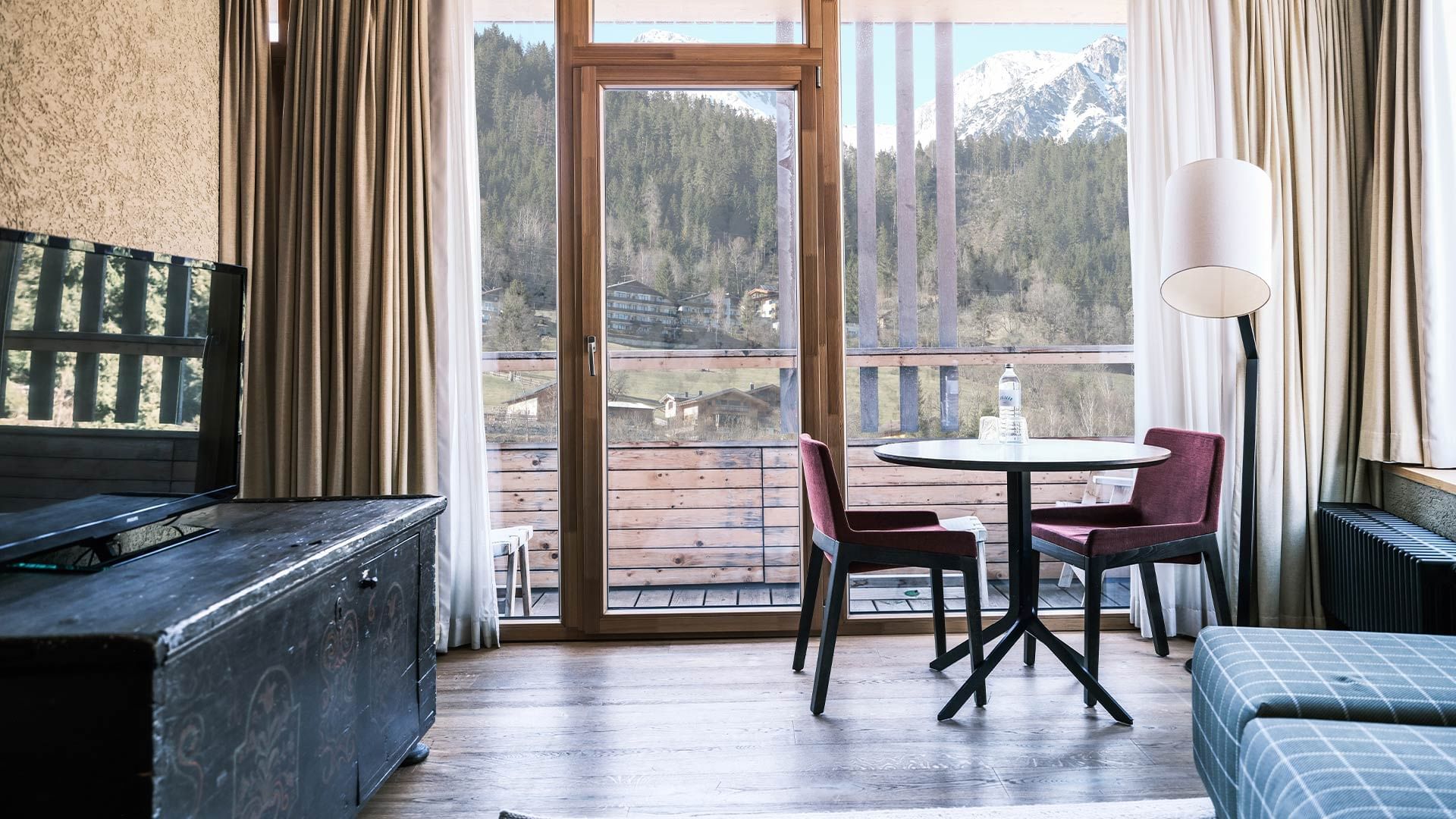 Table with mountain view in Deluxe Suite, Falkensteiner Hotels